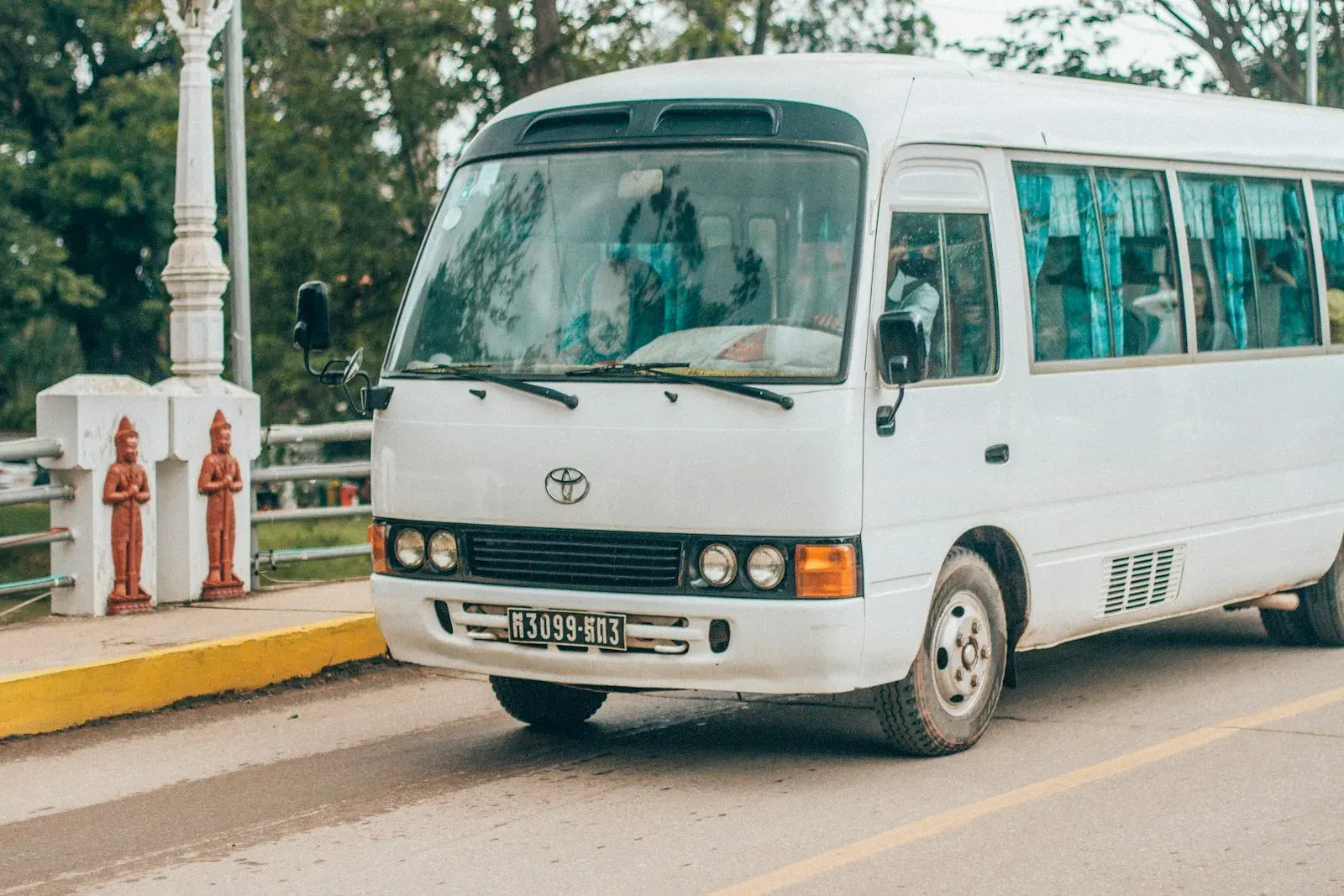 White Toyota Coaster bus