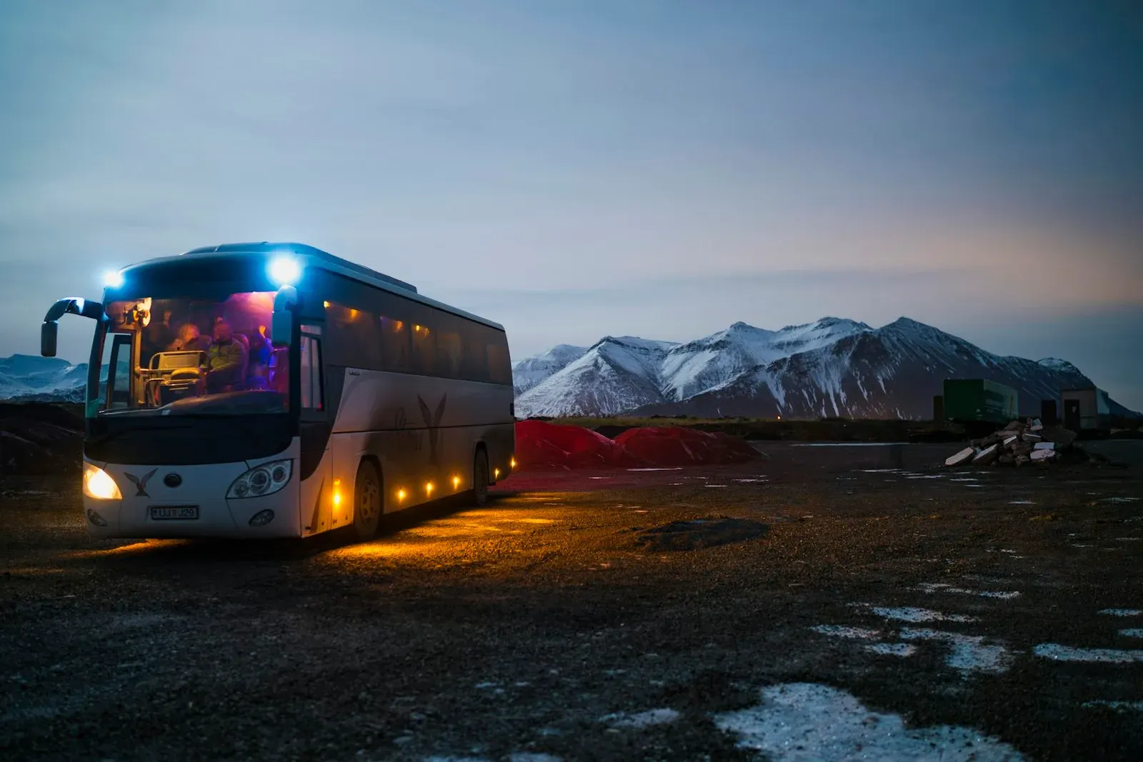 White and black coach on a mountain road