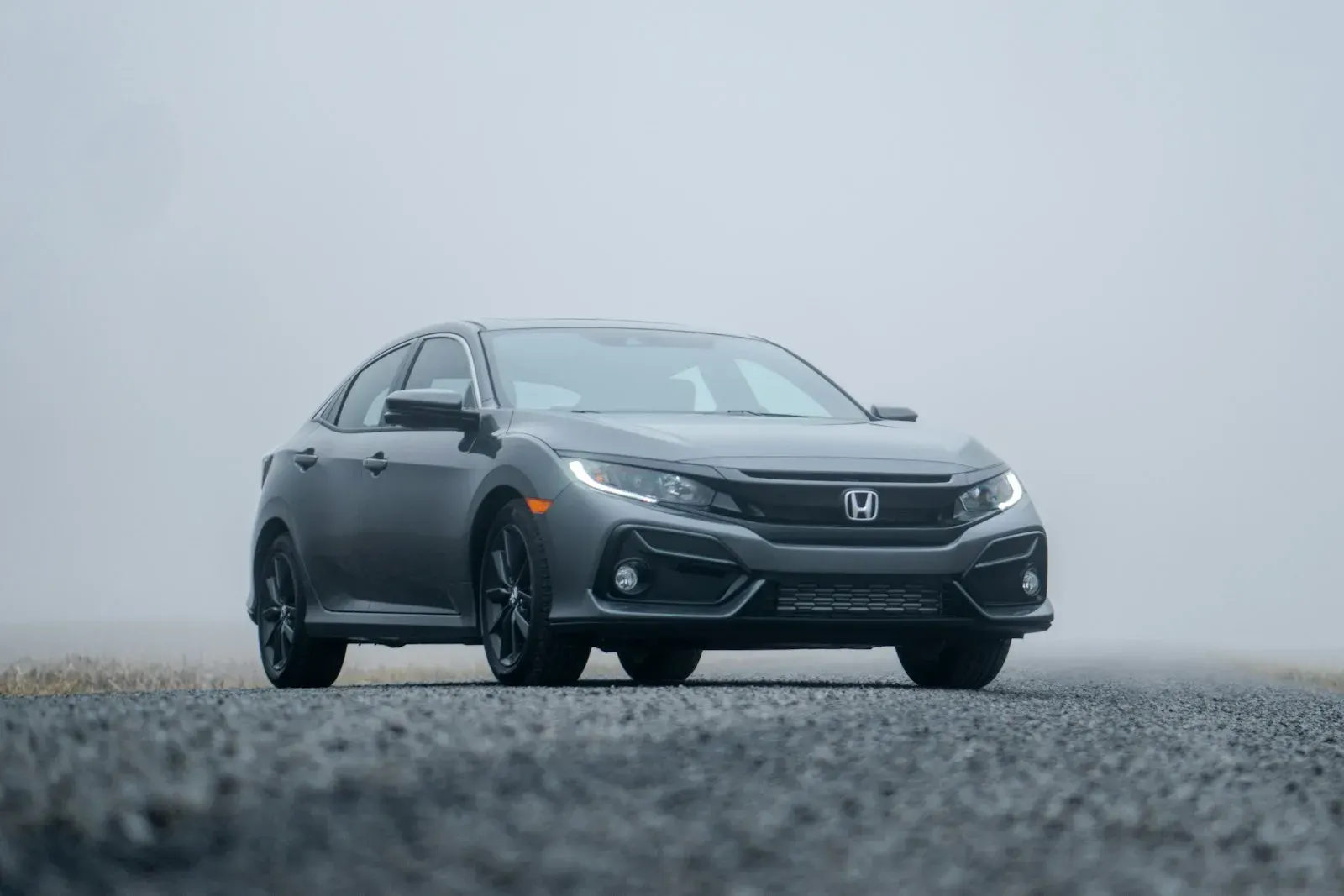 Grey Honda sedan parked on a road