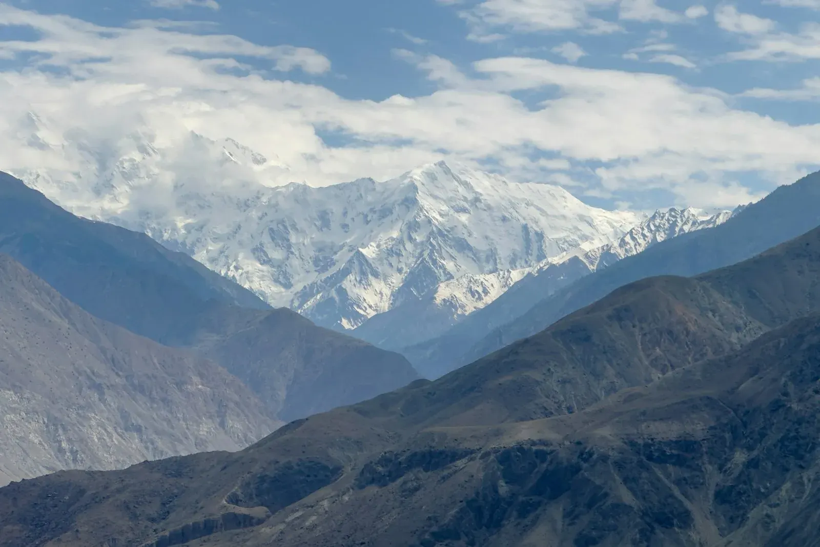 Snow-capped peaks rising above a valley