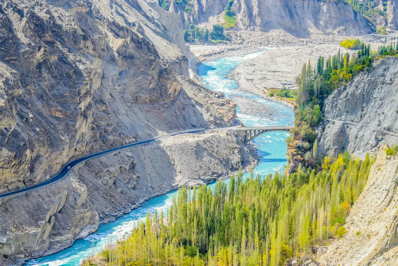 Aerial view of a river winding between mountains
